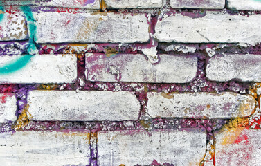 Texture bricks wall stained with multi-colored paint