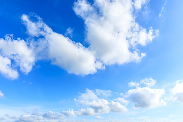 Naklejka na ściany i meble Blue sky and white clouds on a sunny day.