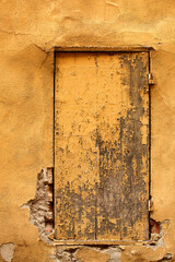 View of small timber door painted yellow