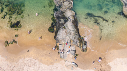 Aerial view on sandy Beach and coast of Atlantic Ocean in Portrush Northern Ireland, Top view on small coastal town 