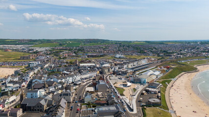 Aerial view on sandy Beach and coast of Atlantic Ocean in Portrush Northern Ireland, Top view on small coastal town 