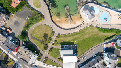 Aerial view on sandy Beach and coast of Atlantic Ocean in Portrush Northern Ireland, Top view on small coastal town 