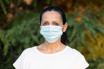 Brunette adult woman with a mask
