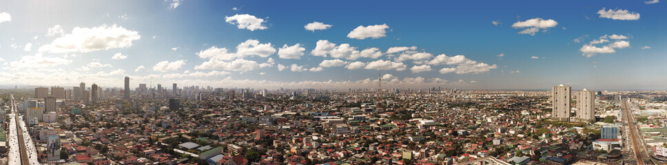 Quezon City, Philippines - March 2020: Panorama of Metro Manila cityscape and skyline viewed from EDSA.