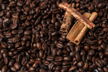 many coffee beans and cinnamon sticks, coffee background