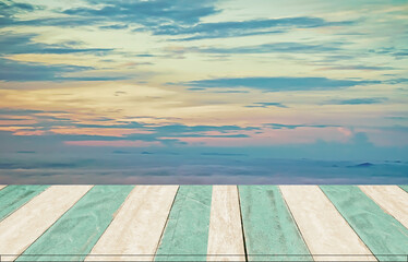 Fototapeta na wymiar colorful sky with blue wooden table ,montage,products display background