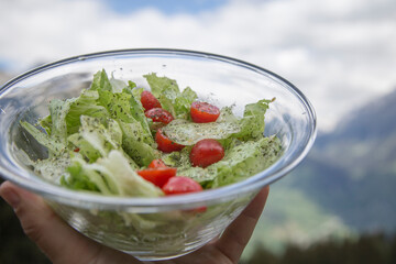 Plat of salad, oil and pepper