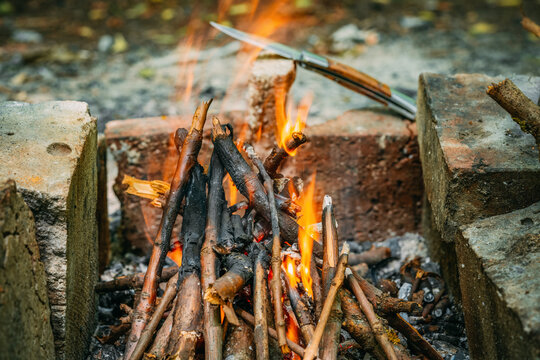 Bonfire is bred between two bricks. Mangal of bricks.