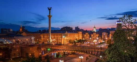 Fotobehang Independence Square in the centre of Kyiv city with Fountains at sunset.  © elena_suvorova