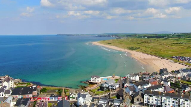 Aerial view on sandy Beach and coast of Atlantic Ocean in Portrush Northern Ireland, Top view on small coastal town 