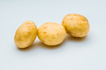 Fresh potatoes on white background