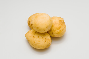 Fresh potatoes on white background