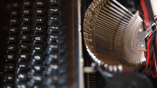 shots of the typewriter of a typewriter while typing on it