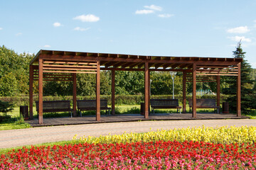 Large arbor in a city park, summer sunny day.