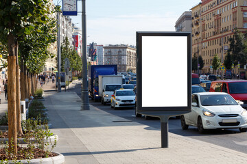 Naklejka premium Billboard at the roadway on the sidewalk in the city.
