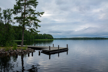 Wooden pier and The Lake Saimaa in the evening, Telataipale Canal, Sulkava, Finland