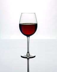 Glass of red wine isolated on white background
