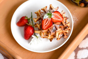 Delicious fresh baked belgian waffles with berries and fruit