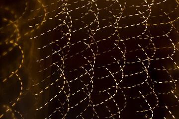 Pattern of moving light on a dark background