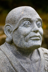 Fototapeta na wymiar sculpture of a buddist monk, at Buddist Temple grounds near Croton-on-Hudson, New York