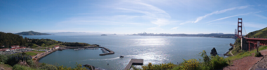 Panorama of San Francisco bay, Alcatraz Island, Golden Gate Bridge,  and city skyline.