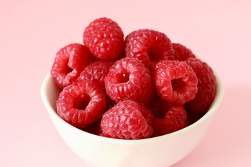 Bowl of fresh, ripe raspberries.