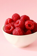 Bowl of fresh, ripe raspberries.