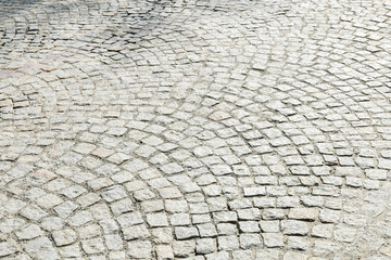 Cobbled street in european city, background.