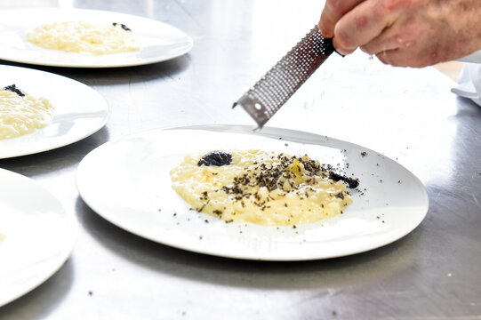 By Grating The Truffle In The Black Truffle Rice Dish