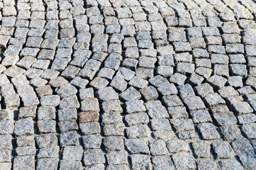 Cobbled street in european city, background.