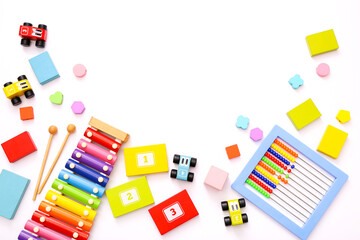 Colorful kids toys on white background. Top view, flat lay.