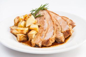 veal breast tip with roasted potatoes and rosemary, roman cuisine, Lazio specialty, Italy