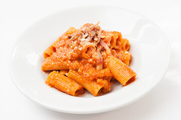 Pasta amatriciana with bacon e tomato sauce Lazio specialty, Italy, isolated on white background