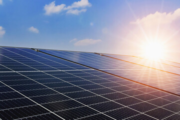 Solar panels with sunset and blue sky background. Clean power energy concept. - obrazy, fototapety, plakaty