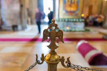 Gilded double-headed eagle - the top of the dividing column in the interior of the Svetitskhoveli Cathedral in the Mtskheta city in Georgia