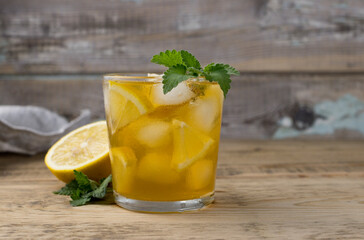 Black iced tea with lemon in a glass