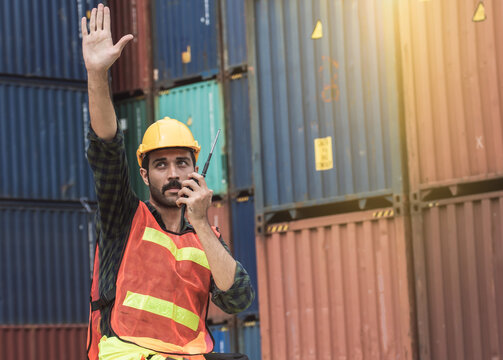 Caucasian foreman wearing helmet and making hand to stop something