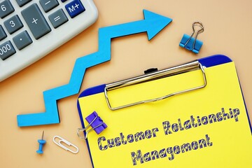 Business concept meaning Customer Relationship Management - CRM with inscription on the page.