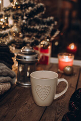 Obraz na płótnie Canvas Winter and Christmas holidays concept. The cup of hot drink. Cozy scene. Background with christmas decor. Christmas background.