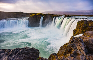 Godafoss waterfall in sunny autumn day, Iceland. Famous tourist attraction of North Iceland.