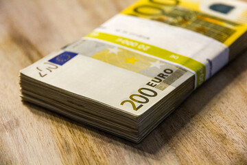 A pile of 200 (twohundred) Euro banknotes.