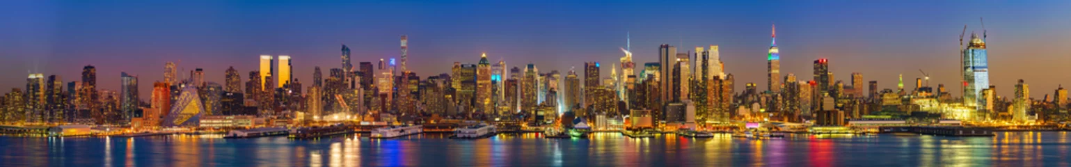  Panoramic view on Manhattan at night, New York, USA © sborisov