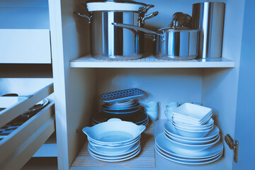 Tableware in the kitchen cabinet, blue
