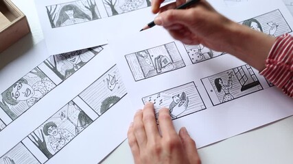 Artist illustrator draws a storyboard for the film. The animator creates sketches for the cartoon.