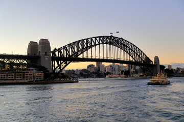 Sydney, Australia - July 17, 2014; Sunrise and sydney harbor bridge view on a beautiful day.