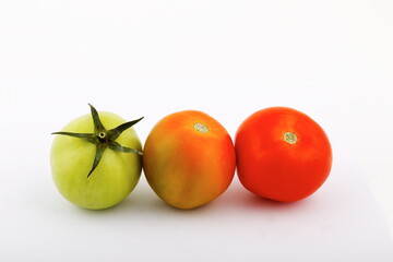 Green and red vegetable composition on white background.
