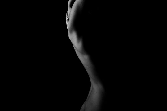 Naked woman's back. Artistic black and white photo