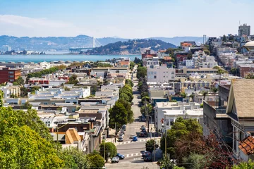 Selbstklebende Fototapeten View towards San Francisco Bay, Russian Hill and North Beach of San Francisco from Russian Hill showing the hilly terrain in a sunny day © Kapi