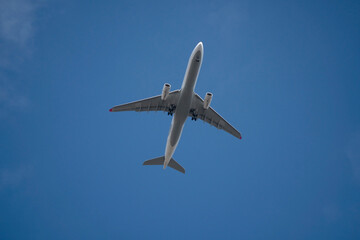 Passenger airplane at the sky from directly below