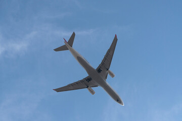 Passenger airplane at the sky from directly below